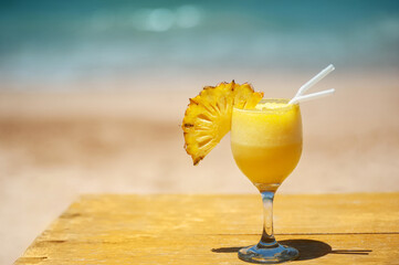 Cocktail on the beach, ocean in the background. relaxing holiday concept.