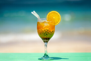 Cocktail on the beach, ocean in the background. relaxing holiday concept.