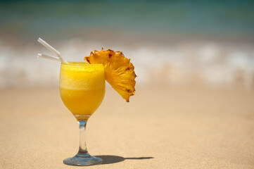 Cocktail on the beach, ocean in the background. relaxing holiday concept.