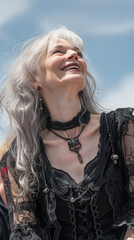 Portrait of an old goth woman enjoying herself in the outdoors.