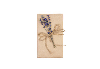 Gift wrapped in eco paper decorated with a sprig of lavender isolated on a white background....