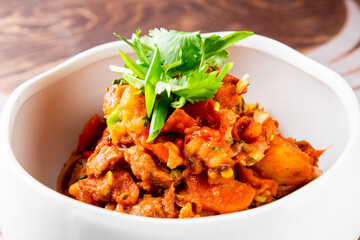 Goulash. Vegetable rague with meat, eggplant, pepper, potato and carrot