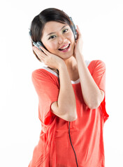 Naklejka premium Happy Chinese woman listening to music.