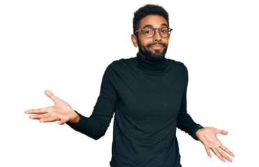 Young african american man wearing casual clothes clueless and confused expression with arms and hands raised. doubt concept.