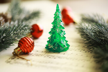 Christmas Sheet Music. Christmas decorations on music sheets, closeup