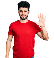 Young arab man with beard wearing casual red t shirt showing and pointing up with fingers number five while smiling confident and happy.