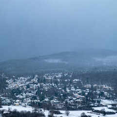 view of the city from the air with snow in the mountain near Munich 