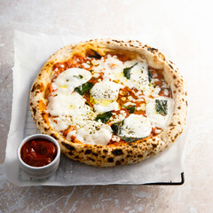 Traditional homemade pizza with tomato sauce and cheese