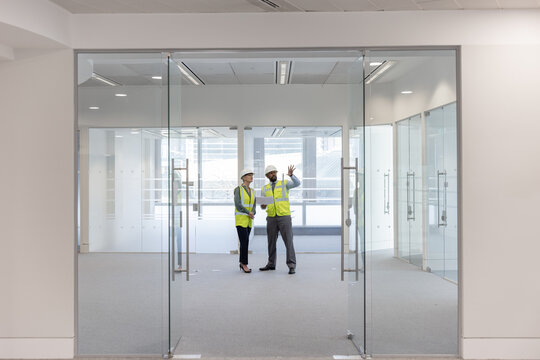 Businessman with Realtor looking at site under construction
