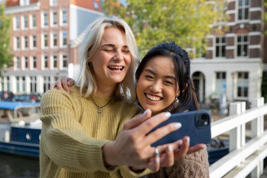 Female Tourists Taking Selfie on City break In Amsterdam, the Netherlands