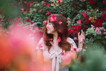Portrait of a beautiful woman at a bougainvillea tree