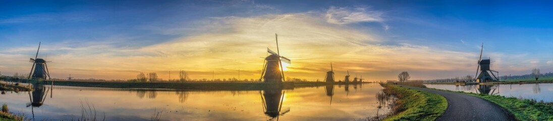 Rotterdam Netherlands, sunrise panorama nature landscape of Dutch Windmill at Kinderdijk Village - obrazy, fototapety, plakaty