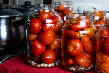 Canning tomatoes, harvesting vegetables. Tomatoes in jars.