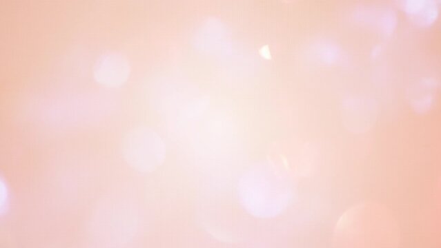 Light Bokeh leaks effect background animation stock footage in peach fuzz color of the year 2024, 4K Background 