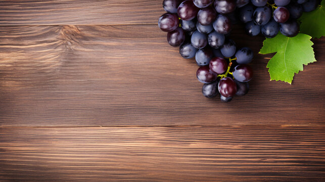 Grape seed and grapes on wooden background.