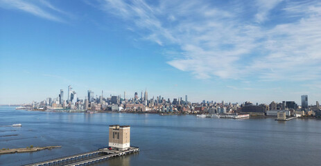 Naklejka premium New York city Manhattan skyline from New Jersey. Manhattan over the Hudson river. NYC cityscape, aerial view. Manhattan downtown skyline with urban skyscrapers. New York Manhattan from above.