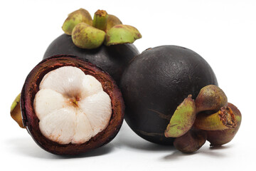 Fototapeta premium Half cut sliced and two whole fresh organic mangosteen delicious fruit isolated on white background clipping path