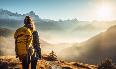 Female hiker traveling, walking alone mountains under sunset light. Woman traveler enjoys with backpack hiking in mountains. Travel, adventure, relax, recharge concept.. - obrazy, fototapety, plakaty