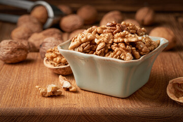 Close-up of a bowl of shelled walnut kernels. Low angle view.