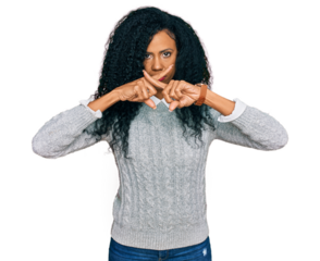 Middle age african american woman wearing casual clothes rejection expression crossing fingers doing negative sign