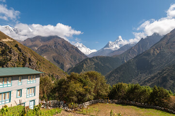 Fototapeta na wymiar View of Lhotse and Ama Dablam mountains during trekking in Nepal in a clear day from Namche Bazar. EBC or Three passes trek in Nepal. Mountain range Himalayas in the Khumbu region of Nepal, Asia.