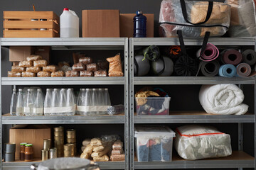 Graphic background image of stacked shelves with food and supplies in warehouse pf refugee help center, copy space