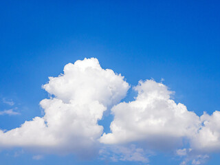 blue sky background with tiny white clouds