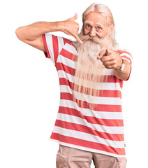 Old senior man with grey hair and long beard wearing striped tshirt smiling doing talking on the...