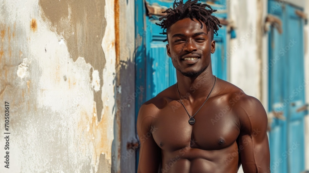 Wall mural handsome african american man with muscular body posing on the street