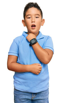 Little boy hispanic kid wearing casual clothes touching painful neck, sore throat for flu, clod and infection