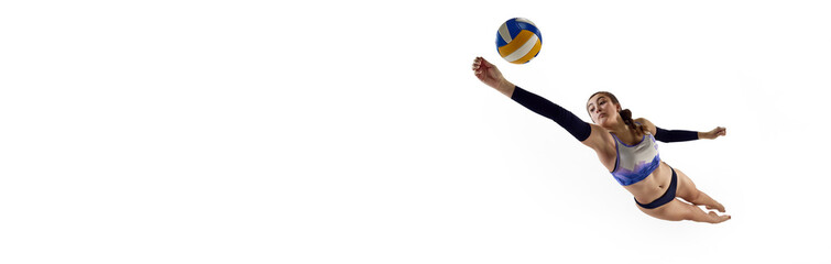 Concentrated and competitive young woman, beach volleyball player hitting ball in monition over...