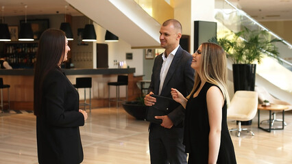 Business woman assistant director meets investors. Business people meeting in the lobby of a modern...