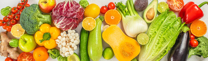 food background with assortment of fresh organic fruits. Long banner format. top view