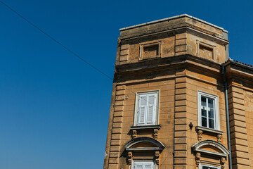 Fototapeta na wymiar Detail of an old Croatian house close-up against the blue sky on a sunny day