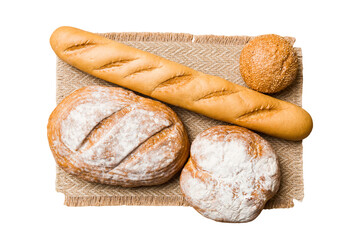 Freshly baked delicious french bread with napkin isolated on white background top view. Healthy white bread loaf