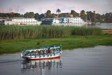 Cairo, Egypt - 8 May 2010: View of a passenger ferry along the Nile river coastline, Cairo, Egypt.