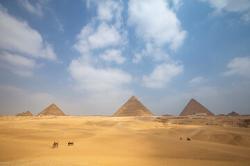 View of The Giza Necropolis, Famed archaeological site featuring the Great Pyramids, the Great Sphinx and The Great Pyramid of Giza in the desert of Giza, Cairo, Egypt.