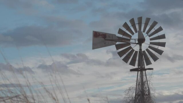 Old windmill at sunset