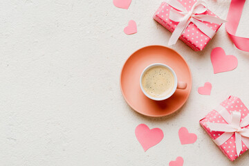 Mug coffee and gift box on colored background. Flat lay composition. Holiday concept