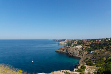 Fototapeta na wymiar Coastal sea rocks. View of the sea cliffs sea and sky from a height.