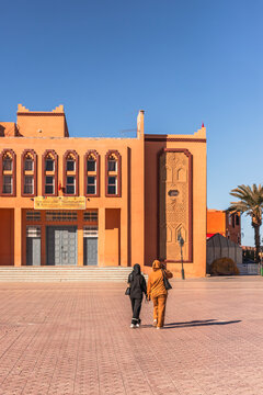View of a person walking in the medina of Ouarzazate, Morocco.