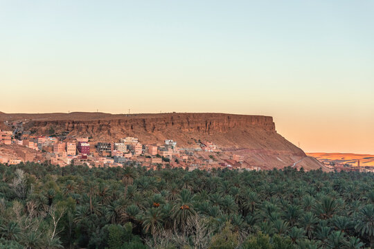 View of the Palmeraie de Tinghir, a valley with palm trees near Ait Ismene village at sunset, Tinghir, Morocco.