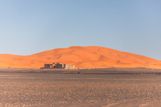 View of Sahara desert sand dunes in Merzouga village, Merzouga desert, Morocco.