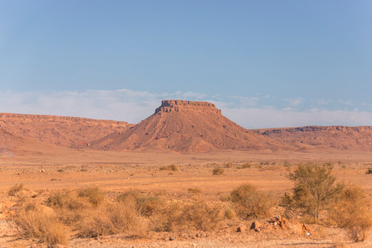 View of mountain rock formation and canyon across the valley near the Sahara desert in Errachidia, Morocco.