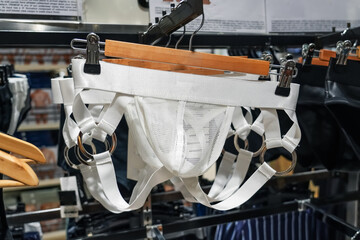 Men's intimate white bikini jock pants panties, revealing erotic striptease show underwear on a...