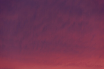 Bright reddish sky at dawn on a winter morning.