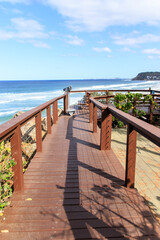 A Peaceful Walkway Overlooking the Beautiful Ocean Waves