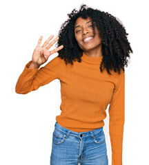 Young african american girl wearing casual clothes showing and pointing up with fingers number four while smiling confident and happy.