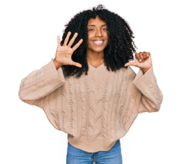 Young african american girl wearing casual clothes showing and pointing up with fingers number six while smiling confident and happy.
