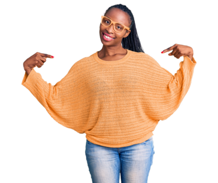 Young african american woman wearing casual clothes and glasses looking confident with smile on face, pointing oneself with fingers proud and happy.